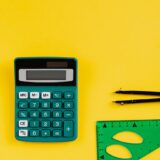 green calculator on yellow background
