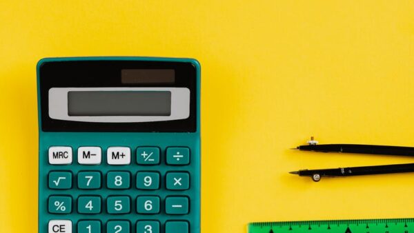 green calculator on yellow background