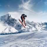 photo of person skiing on snowfield