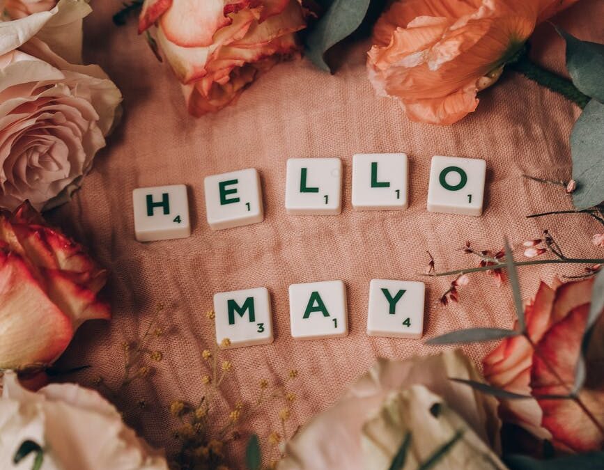 scrabble tiles surrounded by beautiful flowers