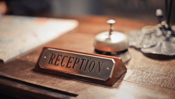 selective focus photo of reception signage