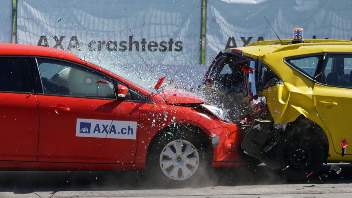 red and yellow hatchback axa crash tests