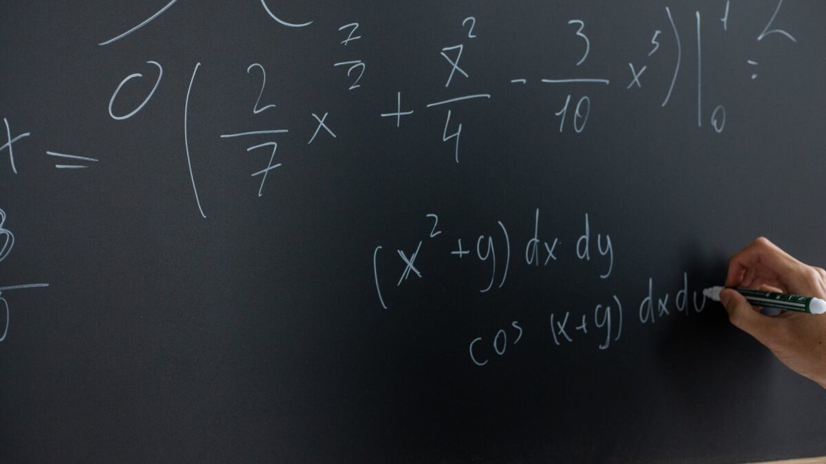 mathematical equation written on blackboard
