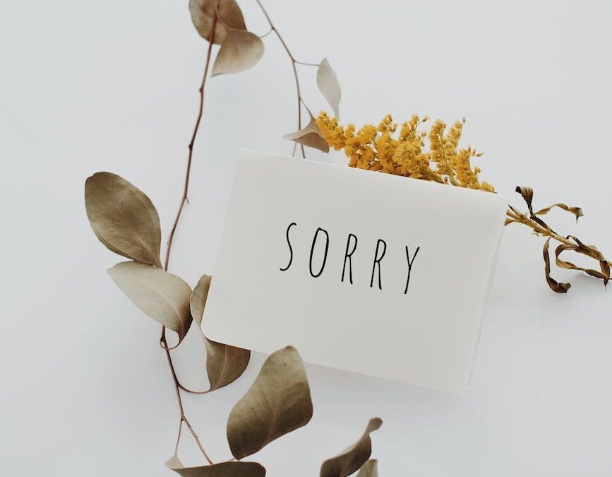 white postcard with sorry message
