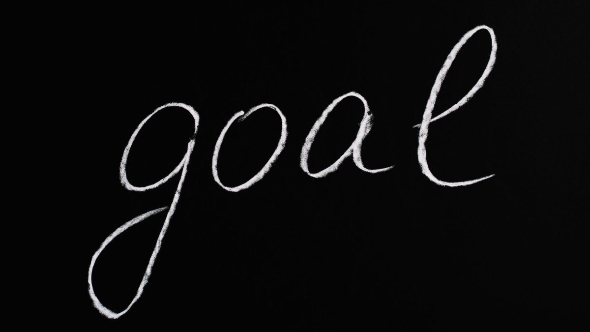 goal lettering text on black background