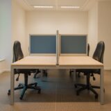 white cubicle with rolling chairs