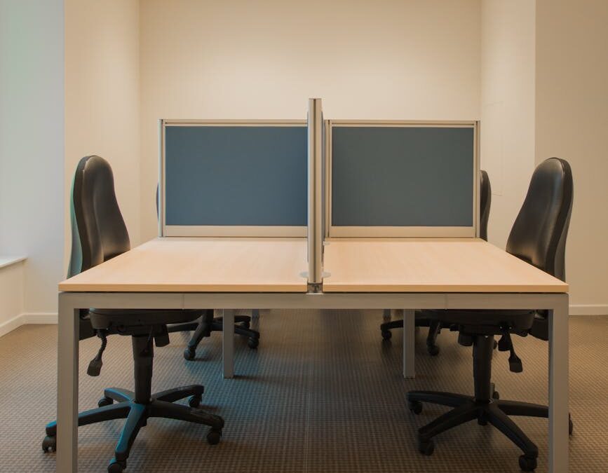 white cubicle with rolling chairs