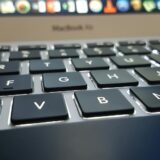 selective focus photography of turned on macbook air