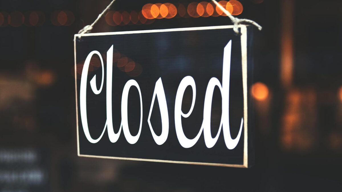 selective focus photography of closed signage