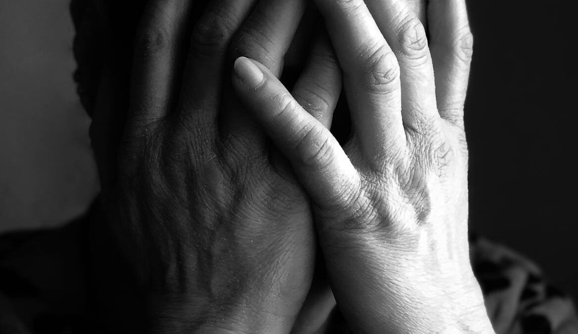 extreme close up of a woman covering her face