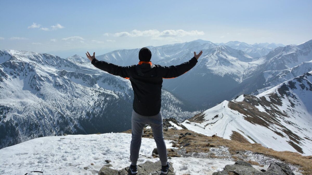 man standing on mountain