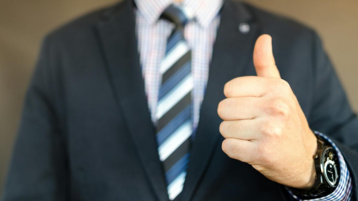 man in black formal suit jacket