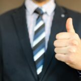 man in black formal suit jacket