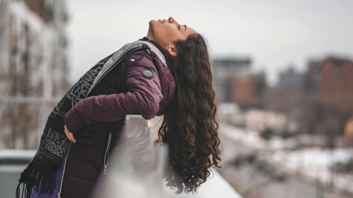 selective focus photography of woman facing upward