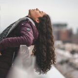 selective focus photography of woman facing upward