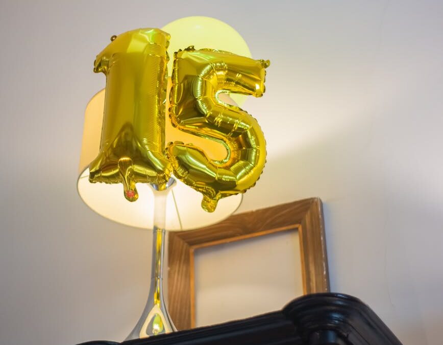 gold number balloons on top of the table