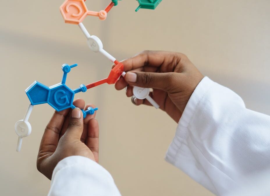 crop chemist holding in hands molecule model