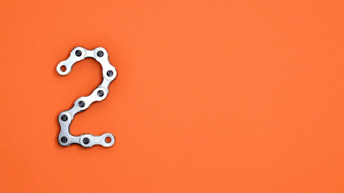 gray steel chain on orange surface