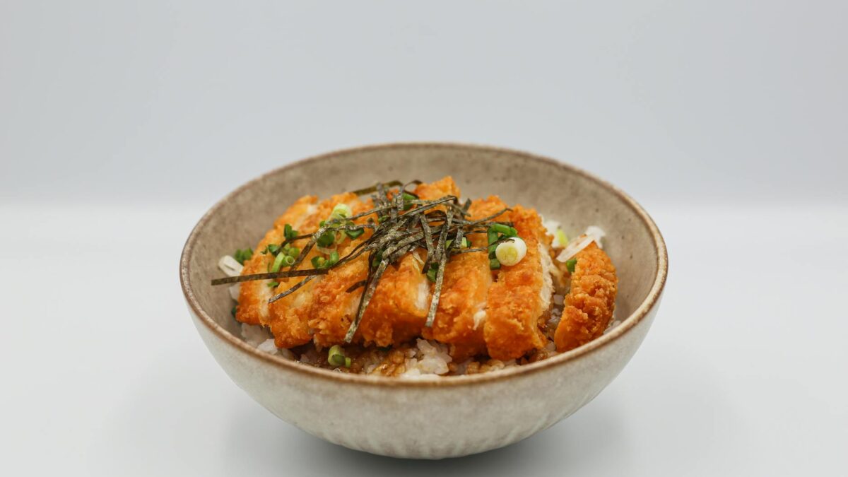 slices of katsu teriyaki and white rice in a bowl