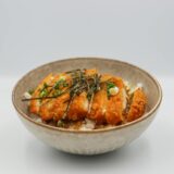 slices of katsu teriyaki and white rice in a bowl