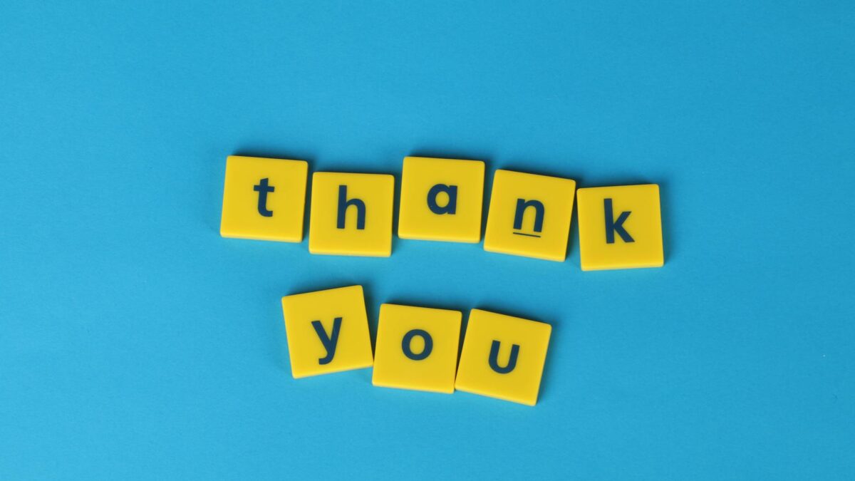 yellow letter tiles on blue background