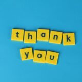 yellow letter tiles on blue background