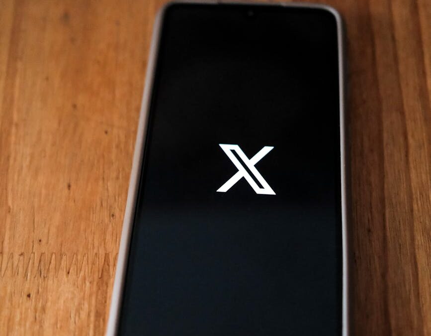 smartphone with social media icon on desk
