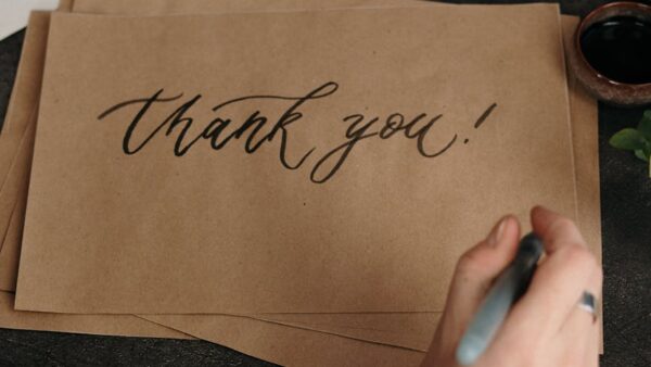 handwritten thank you on craft paper