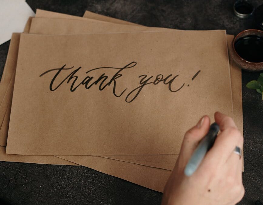 handwritten thank you on craft paper