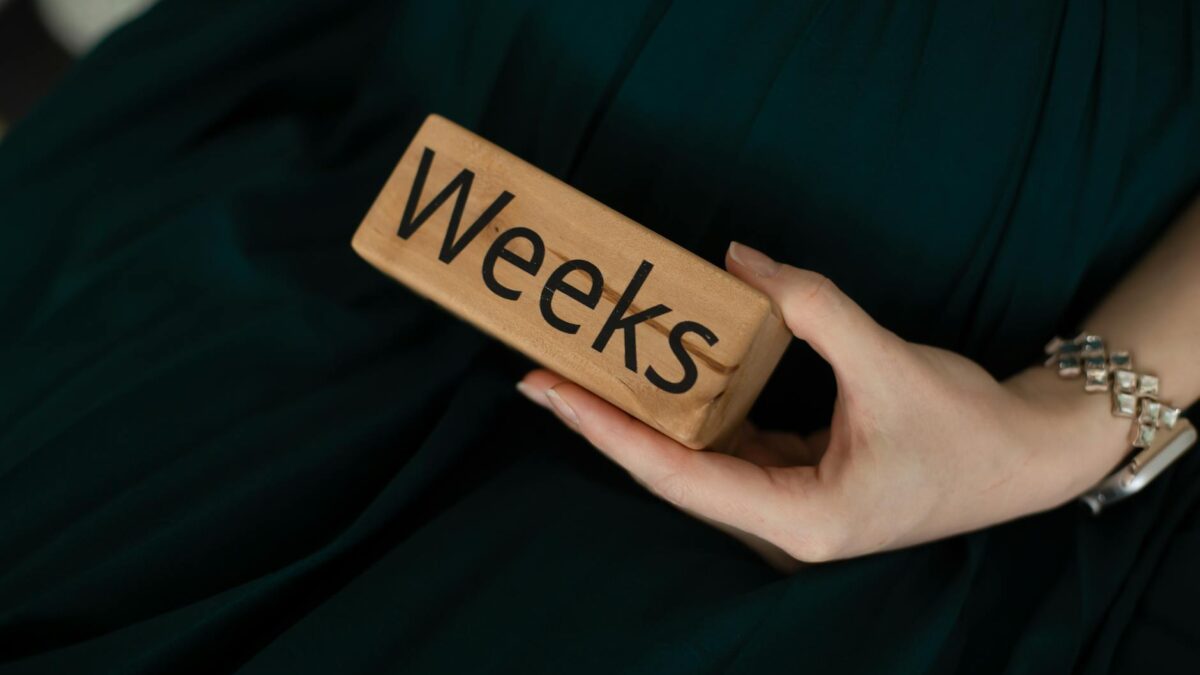 a person holding a block of wood