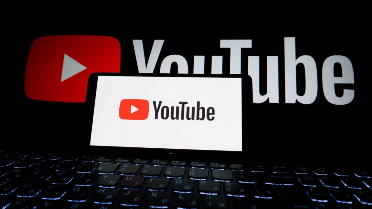 youtube logo on laptop screen in dark setting