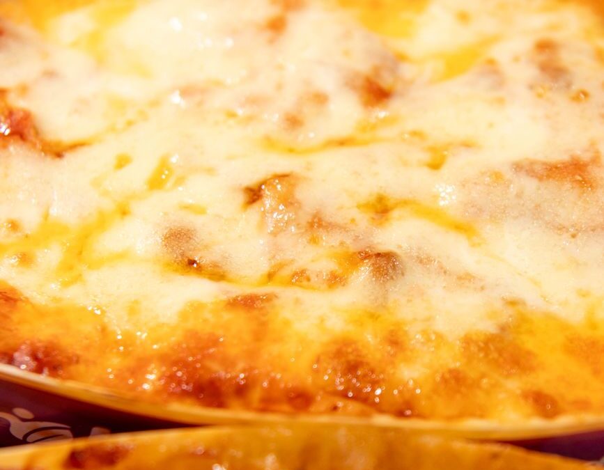 close up of baked cheesy lasagna
